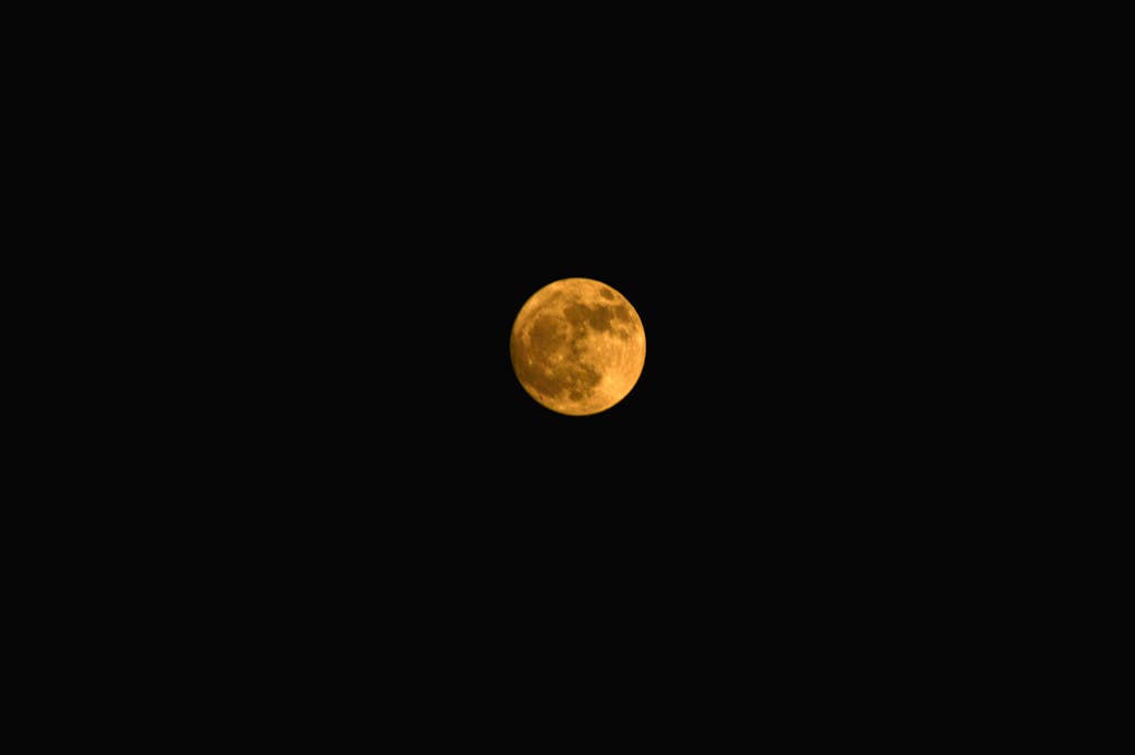Stunning view of the full moon illuminating the night sky in Delhi, India.